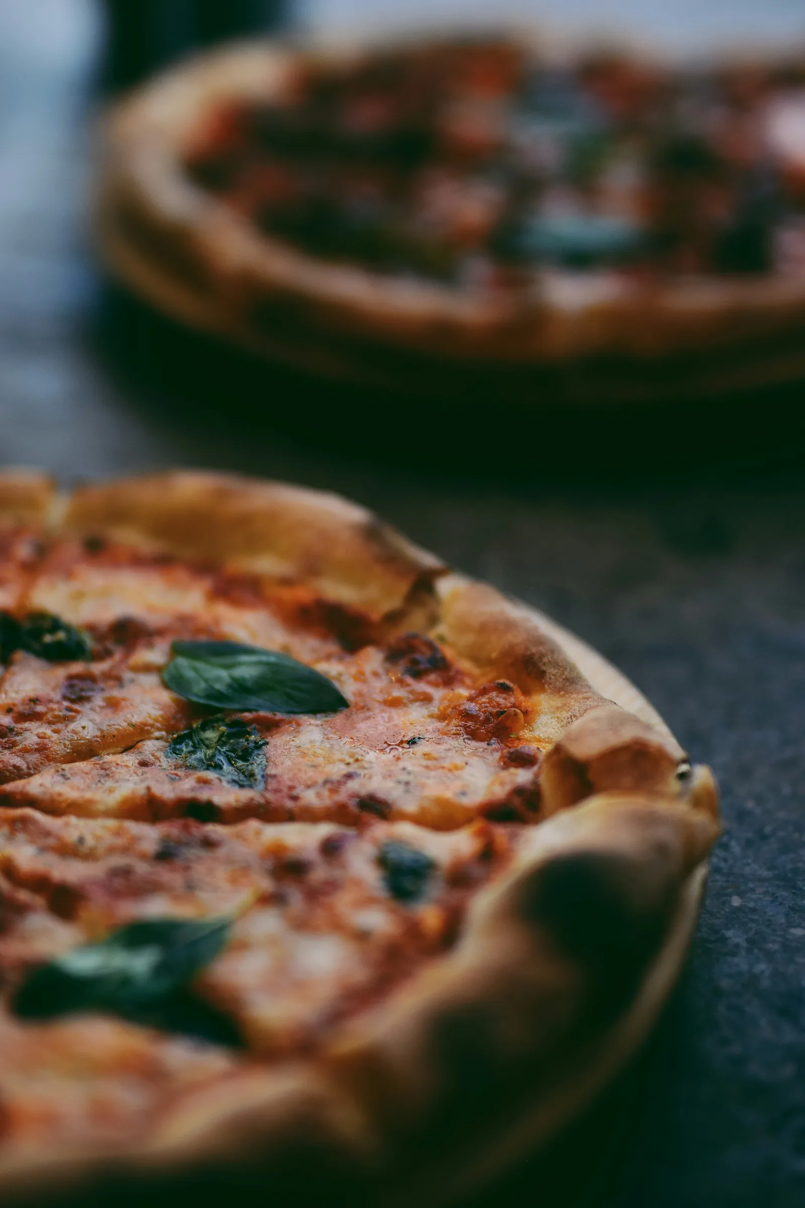 Fresh locally sourced ingredients including tomatoes, peppers, and herbs used in Urban Bites pizzas